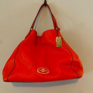 Red-orange Coach shoulder bag